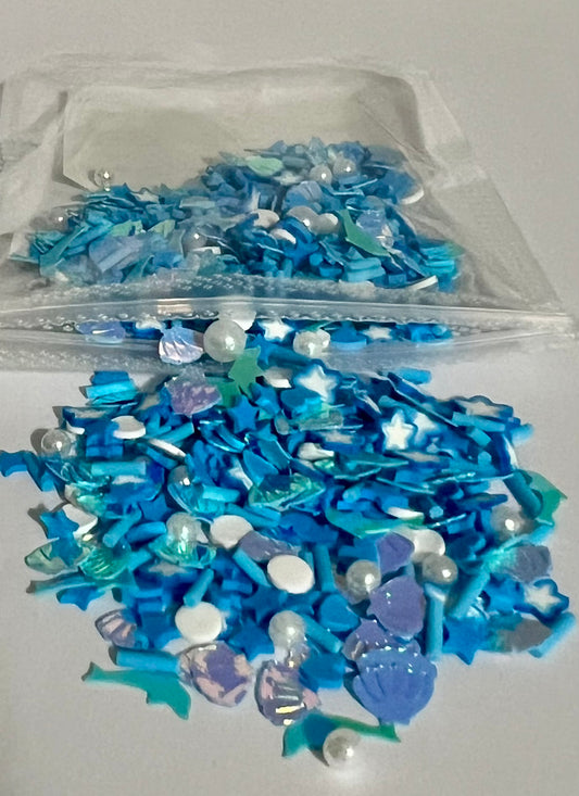 Dolphins, seashells, and pearls blue